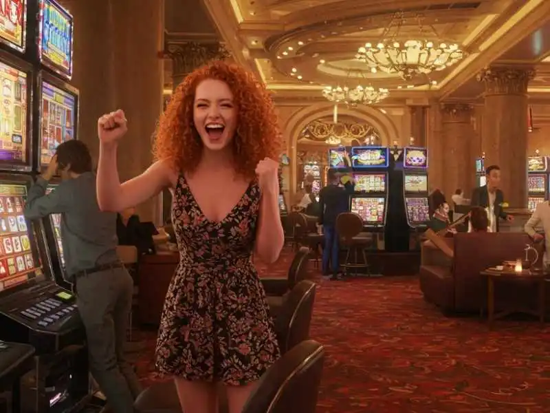 Excited woman winning at a Coin Pusher slot machine in a casino